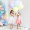 pastel-matte-macaroon-helium-balloon-delivery-small-girl-holding-balloon-bouquet