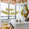 happy anniversary balloons gold set up
